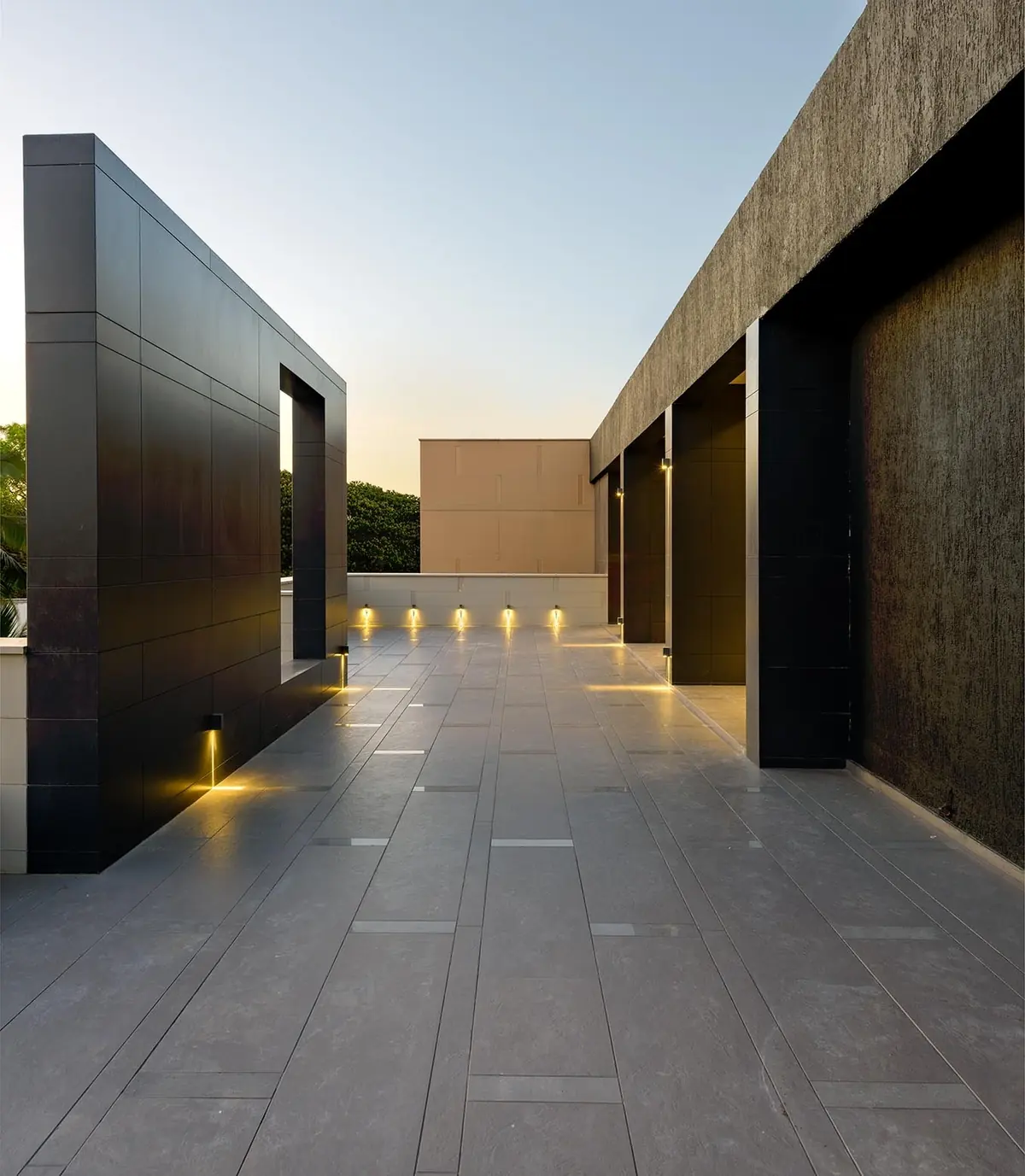 Cutting Edge House: terrace at dusk, lit from the floor.