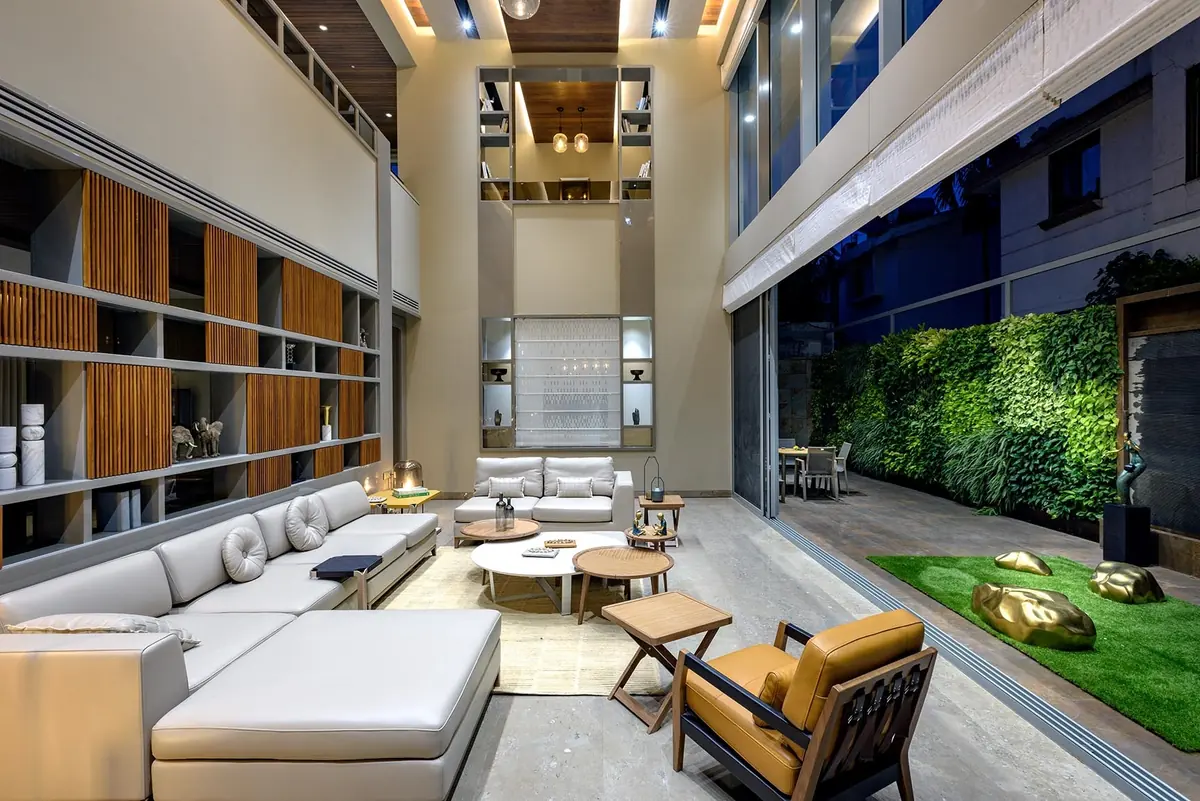 Cutting Edge House: living room opening onto the planted courtyard.